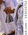 Woman in a traditional white dress 143010702