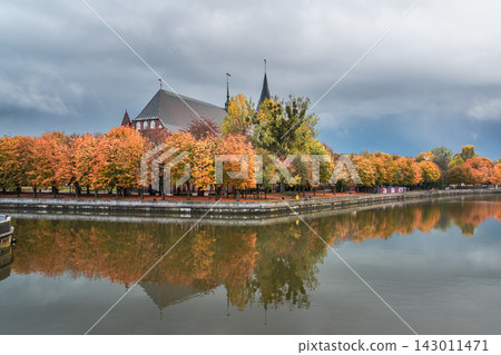 Autumn View of Konigsberg Cathedral from River in Kaliningrad. Russia Autumn View of Konigsberg Cathedral from River in Kaliningrad. Russia 143011471
