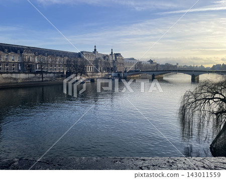 The quiet Seine River in the morning and the historic streets around the Louvre Palace | Winter in Paris The quiet Seine River in the morning and the historic streets around the Louvre Palace | Winter in Paris 143011559