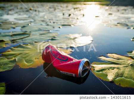Soda can garbage in lake. Coca cola can waste in lake. Aquatic trash, Marine litter. Soda can garbage in lake. Coca cola can waste in lake. Aquatic trash, Marine litter. 143011615