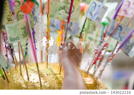 Artificial flowers for Kathin merit tree offering flowers for Buddhist ceremonies. People insert money to make merit in Thailand. Artificial flowers for Kathin merit tree offering flowers for Buddhist ceremonies. People insert money to make merit in Thailand. 143012210