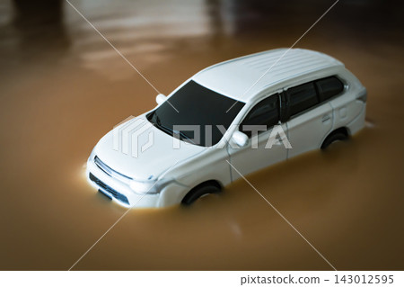 Image of a car submerged in water due to road flooding caused by heavy rain. Image of a car submerged in water due to road flooding caused by heavy rain. 143012595