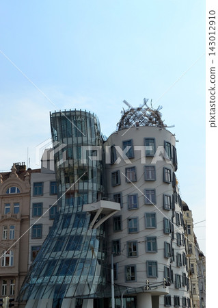 Dancing house modern deconstructivist building in prague with glass tower and metal crown for architecture background and travel banner Dancing house modern deconstructivist building in prague with glass tower and metal crown for architecture background and travel banner 143012910