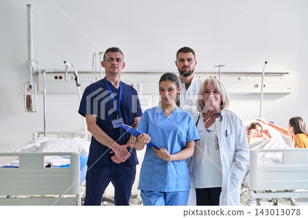 Healthcare team in a hospital ward assisting patients during a busy shift Healthcare team in a hospital ward assisting patients during a busy shift 143013078
