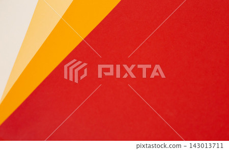 sheets of colored paper. Many colored sheets of paper are laid out in the harsh composition. background of colored paper. warm colors sheets of colored paper. Many colored sheets of paper are laid out in the harsh composition. background of colored paper. warm colors 143013711