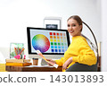 Professional designer with color palettes at workplace in office 143013893