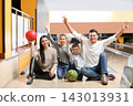 Happy family spending time together in bowling club 143013931
