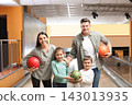 Happy family spending time together in bowling club 143013935
