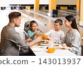 Happy family with pizza and drinks in bowling club 143013937