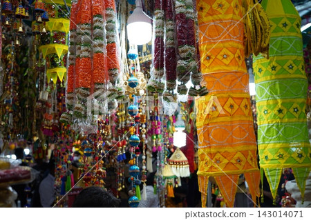 Vibrant Indian Market Decorations and Colorful Garlands Vibrant Indian Market Decorations and Colorful Garlands 143014071