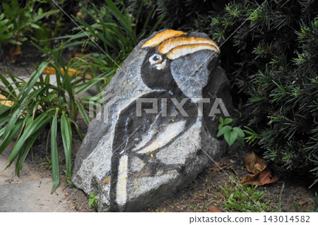 Nature Inspired Hornbill Art on Stone in Garden Nature Inspired Hornbill Art on Stone in Garden 143014582