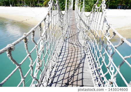 Tropical Rope Bridge Leads to Sunny Beach Paradise Tropical Rope Bridge Leads to Sunny Beach Paradise 143014600