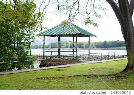 Scenic Park Gazebo by Water with City Skyline View Scenic Park Gazebo by Water with City Skyline View 143015043