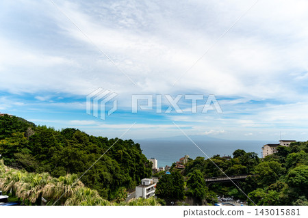 A view from a hilltop overlooking the bridge and the sea. A view from a hilltop overlooking the bridge and the sea. 143015881