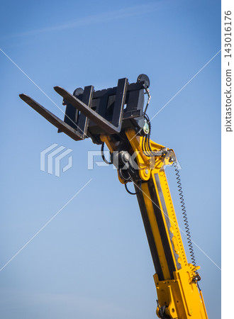 Forklift loader or stacker. Hydraulic and pneumatic mechanism in machine. Technology in transport Forklift loader or stacker. Hydraulic and pneumatic mechanism in machine. Technology in transport 143016176