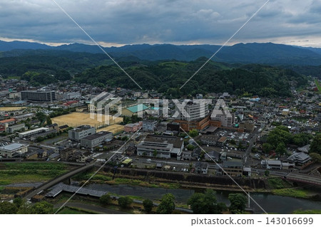Aerial photograph capturing the city center, river, and bridges of Hitoyoshi City, Kumamoto Prefecture. Aerial photograph capturing the city center, river, and bridges of Hitoyoshi City, Kumamoto Prefecture. 143016699