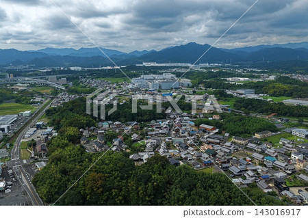An aerial photograph capturing the city and mountain range of Kameyama City, Mie Prefecture. An aerial photograph capturing the city and mountain range of Kameyama City, Mie Prefecture. 143016917