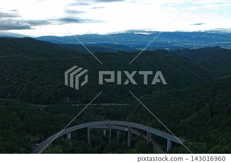 An aerial photograph capturing the arch bridge and mountain range in Hitoyoshi City, Kumamoto Prefecture. An aerial photograph capturing the arch bridge and mountain range in Hitoyoshi City, Kumamoto Prefecture. 143016960