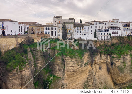 Panoramic view of surrounding landscapes and mountains from scenic elevated viewpoint in Ronda, Spain. Panoramic view of surrounding landscapes and mountains from scenic elevated viewpoint in Ronda, Spain. 143017160