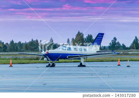 Private turboprop aircraft at the airport in the morning light 143017280