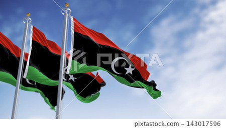 National flags of Libya waving on a clear day. National flags of Libya waving on a clear day. 143017596