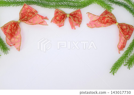 background Christmas festive border with red bows and pine branches background Christmas festive border with red bows and pine branches 143017730