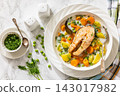 Creamy salmon soup with carrots, rutabaga, potato 143017982