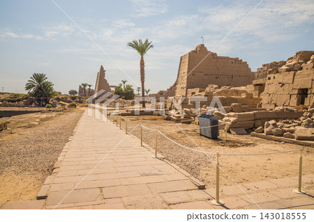 Ancient Egyptian stone ruins and pyramid under clear blue sky Ancient Egyptian stone ruins and pyramid under clear blue sky 143018555