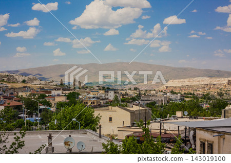 Goreme, Turkey - panorama view of the town of Goreme in Cappadocia, Turkey with fairy chimneys, houses, and unique rock formations seen from sunrise point Goreme, Turkey - panorama view of the town of Goreme in Cappadocia, Turkey with fairy chimneys, houses, and unique rock formations seen from sunrise point 143019100
