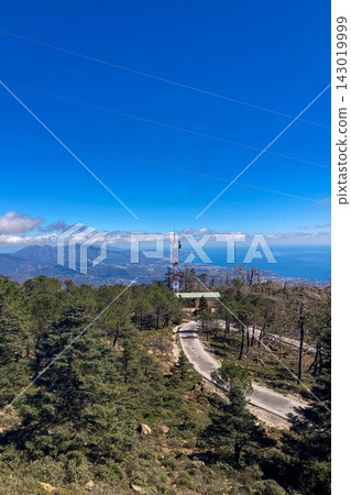 Sweeping mountain panorama revealing the sparkling Mediterranean Sea, Estepona and distant Gibraltar beneath open skies from Sierra Bermeja in Spain. Sweeping mountain panorama revealing the sparkling Mediterranean Sea, Estepona and distant Gibraltar beneath open skies from Sierra Bermeja in Spain. 143019999