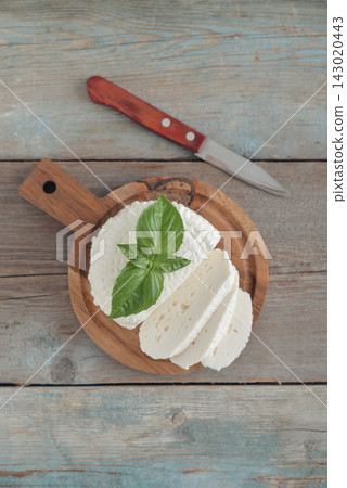 Bryndza cheese on a wooden cutting board Bryndza cheese on a wooden cutting board 143020443