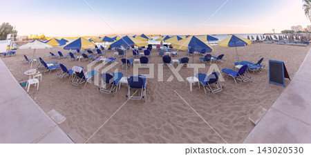 Sun Loungers and Umbrellas on Sandy Beach in Chania, Crete, Greece Sun Loungers and Umbrellas on Sandy Beach in Chania, Crete, Greece 143020530