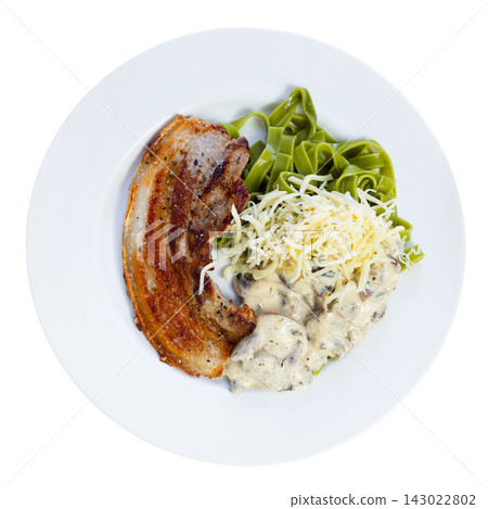 Pasta with mushrooms and a piece of pork on a plate, top view Pasta with mushrooms and a piece of pork on a plate, top view 143022802