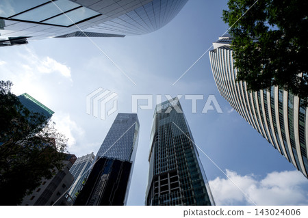 Singapore CBD skyscrapers towering perspective dramatic upward angle modern financial district 143024006