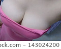 A voluptuous young woman in a pink tank top A voluptuous young woman in a pink tank top 143024200