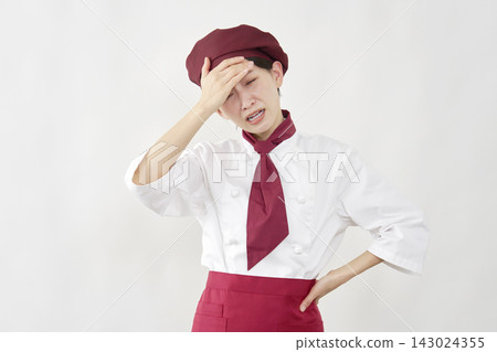 Female pastry chef in distress, white background Female pastry chef in distress, white background 143024355