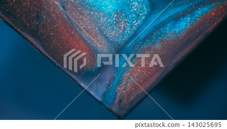 Paint splash. Glitter pigment. Blur blue orange purple color triangle marble blend shiny texture spilling on abstract art background. Paint splash. Glitter pigment. Blur blue orange purple color triangle marble blend shiny texture spilling on abstract art background. 143025695