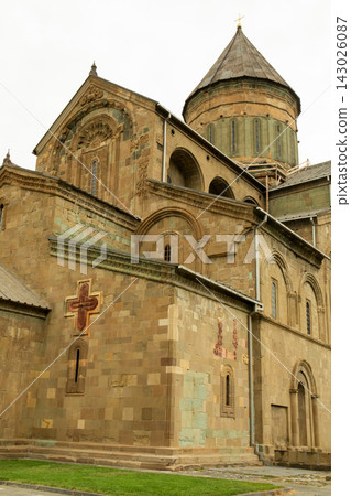 Ancient cathedral showcases detailed stonework and religious symbols Ancient cathedral showcases detailed stonework and religious symbols 143026087