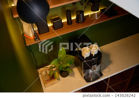 Modern coffee station at home with espresso machine and brewing tools Modern coffee station at home with espresso machine and brewing tools 143026242