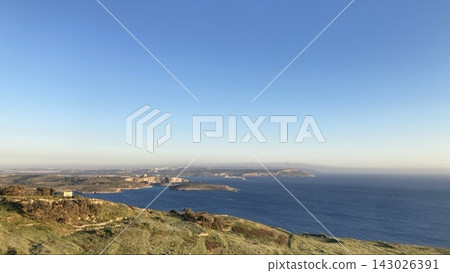 A breathtaking panoramic view of the Mediterranean, where vast blue seas and green hills intertwine. A breathtaking panoramic view of the Mediterranean, where vast blue seas and green hills intertwine. 143026391