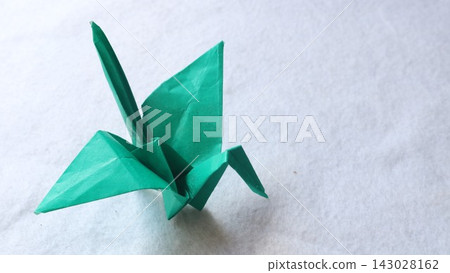 Origami crane on white background Origami crane on white background 143028162