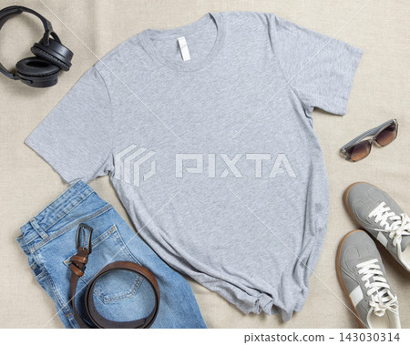 Blank heather grey unisex t-shirt mockup, crewneck flat lay with denim jeans and mens accessories Blank heather grey unisex t-shirt mockup, crewneck flat lay with denim jeans and mens accessories 143030314