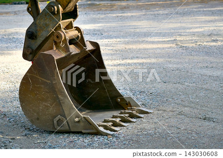 Ready to work.Excavator bulldozer bucket on construction site Ready to work.Excavator bulldozer bucket on construction site 143030608