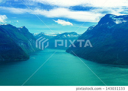 View of the fjord from above. Beautiful Geirangerfjord at sunset, Norway View of the fjord from above. Beautiful Geirangerfjord at sunset, Norway 143031133