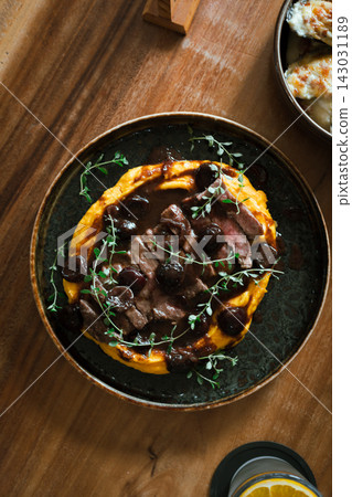 Grilled Australian Striploin with cherry red wine sauce. 143031189