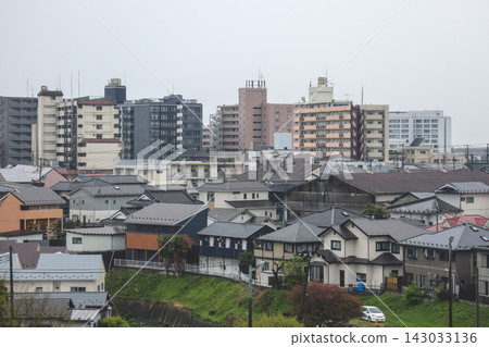 April 27 2026 Morioka urban residential rooftops with powerlines and distant skyline April 27 2026 Morioka urban residential rooftops with powerlines and distant skyline 143033136