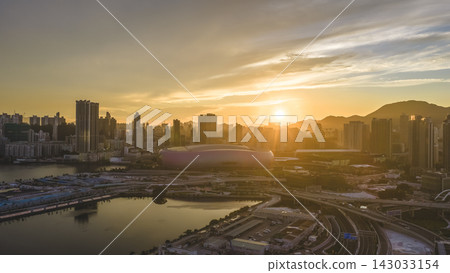 Hong Kong, July 10 2026 Golden Sunset Above Kai Tak Sports Park Skyline Hong Kong, July 10 2026 Golden Sunset Above Kai Tak Sports Park Skyline 143033154