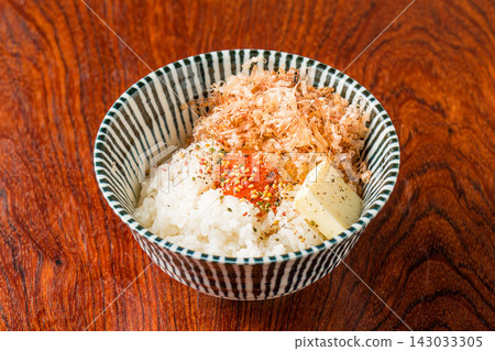 The ultimate egg rice bowl with the rich flavors of bonito flakes and butter. The ultimate egg rice bowl with the rich flavors of bonito flakes and butter. 143033305