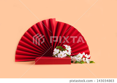 Abstract fashion podium for advertising cosmetics products. Red podium paper oriental fan pink pastel background Abstract fashion podium for advertising cosmetics products. Red podium paper oriental fan pink pastel background 143034863