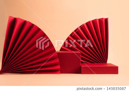 Abstract fashion podium for advertising cosmetics products. Red podium paper oriental fan pink pastel background Abstract fashion podium for advertising cosmetics products. Red podium paper oriental fan pink pastel background 143035087